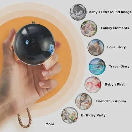 Video memory orb held in a hand, showing its compact size